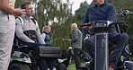 Golf course, conversation and friends at field for sport, competition and training in summer. Golfers, team chat and people with a disability on wheelchair outdoor, group break and healthy exercise