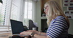 Student woman, typing and laptop in home with assessment, glasses and thinking for online course. Girl, click and scroll with computer for e learning, studying and scholarship with problem solving