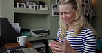 Woman, student and phone with texting, laptop and home with coffee cup, reading and happy for contact. Girl, smartphone and smile with click, scroll and social network app at desk, tea and thinking