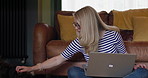 Woman, sitting on floor and laptop with dogs, work from home and playful with affection and happy. Freelancer, living room and tech for career, entrepreneur and animals to keep her company for job
