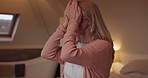 Night, stress or hands of a woman in the bedroom of her home feeling exhausted with insomnia. Face, mental health or pressure and a tired or sleepless person sitting on a bed in an apartment