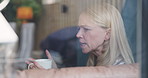 Coffee cup, window and morning face of woman talking, speaking and share weekend story, gossip or news. Living room discussion, transparent glass and person relax, social and home conversation chat