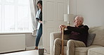 Old man, walking stick and thinking in home on sofa with caregiver, support or lonely in retirement. Elderly, dementia and senior person with a disability and help in house with nurse or therapist