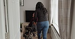 Woman, nurse and senior patient in wheelchair for support, healthcare assistance or help at old age home. Female caregiver or volunteer pushing elderly man or person with a disability in living room