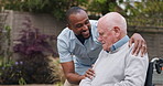 Outdoor, wheelchair and nurse with old man, smile and support with conversation, recover and healing. Pensioner in a garden, person with disability and caregiver with patient, help and rehabilitation