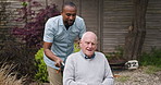 Wheelchair, outdoor and nurse with old man, helping and recovery with rehabilitation, wellness and support. Pensioner, person with a disability and caregiver with healing, outside and healthcare