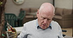 Senior man, gardening and arm pain with scissor outdoor in backyard with plant care and cutting leaves. Elderly male person, stretching and working on lawn at home in retirement with injury at house