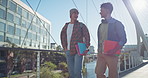 University, smile and people with books at campus for education, knowledge or travel to class together. Bridge, friends and student by building for learning, scholarship or morning commute to academy