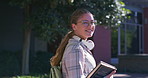 Face, books and happy woman walking at university campus outdoor for learning opportunity or education. Portrait, smile and student at college for school, knowledge and academic glasses in Canada
