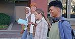 Happy students, group and walking with books to class for learning, education or social chat at campus. Young people, diversity or learners with friends for conversation or discussion at college