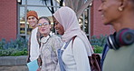 Happy people, students and walking with books to class for learning, education or social chat at campus. Young group, diversity or learners with friends for conversation or discussion at college