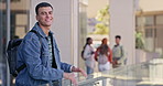 University student, man and happy at campus, face and ready for study, scholarship or development. Person, portrait and smile with backpack for education, learning and outdoor with pride at college