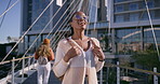 University, woman and walking with back at campus for learning, knowledge and travel to academy. Students, friends and people by buildings on bridge for higher education, scholarship and journey