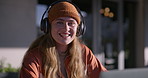 Girl, face and college student with headphones outdoor for learning, music and education. Happy, audio tech and portrait of female person study for university, scholarship or admission test in London