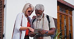 Mature couple, outdoor and map for directions to navigate city as tourist on holiday, break and relax. Multiracial relationship and people with smile or happy for traveling, tour and vacation