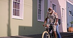 Happy, senior couple and travel with bicycle for riding, adventure and exploring on vacation together. City street, woman and man with bike for cycling, connection and bonding with smile in marriage