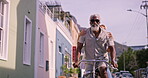 Portrait, senior couple and travel with bicycle for riding, adventure or exploring on vacation together. City street, woman and man with bike for cycling, connection or bonding with smile in marriage