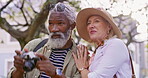 Travel, senior couple and camera with love, vacation and adventure with romance, bonding together and carefree. New York, man and woman with picture, tourism and journey with conversation and trip