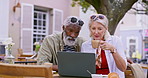 City, laptop and mature couple at coffee shop for online itinerary, travel plans and tourist website. Retirement, marriage and happy man and woman on computer for holiday, vacation and adventure