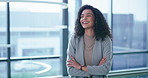 Arms crossed, smile and vision with business woman at window of corporate office for planning. Future, idea and thinking with portrait of happy employee in suit at workplace for career development