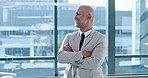 Arms crossed, laughing and thinking with business man at window of corporate office for planning. Future, idea and vision with portrait of funny employee in suit at workplace for career development