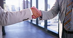 Business, people and handshake in office with hello for introduction, greeting or meeting. Company merger, employees and shaking hands in building for partnership deal, contract agreement and welcome