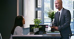 Business man, appointment and receptionist at corporate consultation agency with secretary. Client, lobby and waiting with phone at office admin counter and welcome desk with check in for meeting