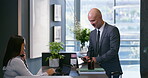 Business man, appointment and reception chat at corporate consultation agency with secretary. Client, lobby and waiting room with phone at admin counter and welcome desk with check in for meeting