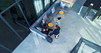 Above, airport and business people with planning, talking or conversation with finance company. Employees, global trade or travellers in office, teamwork or cooperation with professional or corporate