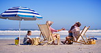 Family, excited and children at ocean with hug, bonding and happiness on summer vacation. Parents, kids and embrace at beach umbrella for love, support and appreciation for travel to California