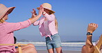 Sea, high five and family with child, beach chair and motivation with parents outdoor in sun. Happy, vacation and travel with love, support and care together with playing by ocean on holiday in Miami