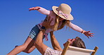Sea, hug and family, dad lifting child in air with beach chair, embrace and outdoor in sun. Airplane game, vacation and travel with love, support and care with playing by ocean on holiday in Miami