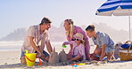 Family, sea and building a sandcastle on holiday, love and laughing together for humor in nature. Parents, children and playing games with sand on vacation, outdoor and funny conversation with toys