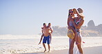 Water, journey and family in vacation, beach and children with parents, happy and travel for bonding. Outdoor, people and kids in holiday, mom and dad with youth, relax and adventure in weekend