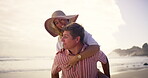 Love, piggyback and walking with couple on beach together for honeymoon holiday, travel or vacation. Anniversary, carry or romance with happy man and woman outdoor in nature for adventure or bonding