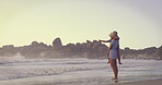 Beach, carry or pointing with mother and daughter on sand outdoor for holiday, travel or vacation together. Love, morning or showing with single parent woman and girl child by ocean for bonding