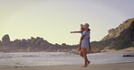 Beach, pointing or walking with mother and daughter outdoor for holiday, travel or vacation together. Carry, love or weekend with single parent woman and girl child by ocean or sea for bonding
