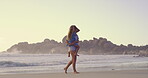 Beach, carry or walking with mother and daughter on sand outdoor for holiday, travel or vacation together. Love, morning or weekend with single parent woman and girl child by ocean or sea for bonding