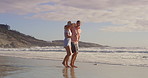 Happy, couple and beach with fun, holiday and tropical island with love, care and outdoor date. Swing, vacation and people together with ocean, sea and summer travel in Bali for anniversary on trip