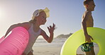 Running, inflatable and summer with children at beach for travel destination, family vacation and freedom. Holiday, playful and energy with kid siblings and swimming float for adventure and happiness
