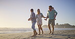 Parents, talking or happy kids at sea walking on holiday or fun travel with boy, girl or family. Siblings, mom or dad with children at beach on vacation together for wellness, joy or nature to relax
