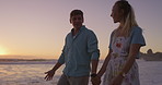 Beach, conversation and couple on holiday, holding hands and bonding in nature, talking and romance on date. Love, man and happy with woman, travel and peace of ocean, relax and getaway for lovers