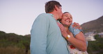Happy couple, love and outdoor with kiss for marriage, travel and commitment on vacation. Mature man, woman and hug on beach for anniversary, milestone holiday and healthy relationship in California