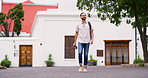 Walking, man and city with travel, camera and backpack on holiday with urban photography and smile. Relax, street and trip to London with vacation, journey and bag of tourist to explore on weekend