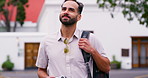 Traveller, man and walking in street, journey and smile with tourism, urban buildings and Canada. Person, outdoor and guy in road, adventure and vacation with getaway trip, relax and commute