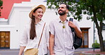 Couple, happy and travel with holding hands in city with sightseeing view, urban tourism and bonding together. Smile, people and walking with vacation commute, adventure and romantic for relationship