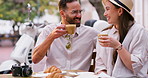 Coffee date, couple and cafe, laugh and joke for bonding at outdoor table for holiday. Man, woman and drink with relax, communication and talk with love, care and restaurant conversation for travel