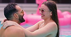 Swimming pool, happy and couple dance on holiday, laugh or hug outdoor for connection on vacation. Smile, man and woman in water with swimsuit for romantic love, spinning and playful on date to relax