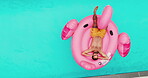 Man, relax and floating on ring in swimming pool for summer vacation, luxury resort and hospitality trip. Aerial, male person and rest for inflatable flamingo, water and holiday destination at lodge 
