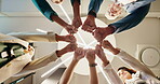 Business, group and hands with fist bump in circle for company synergy, partnership and collaboration. Low angle, employees and people with workplace integration, cooperation and support in office